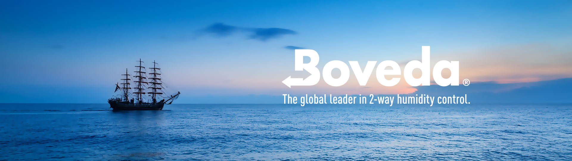 A ship at dusk by a Boveda logo overlay