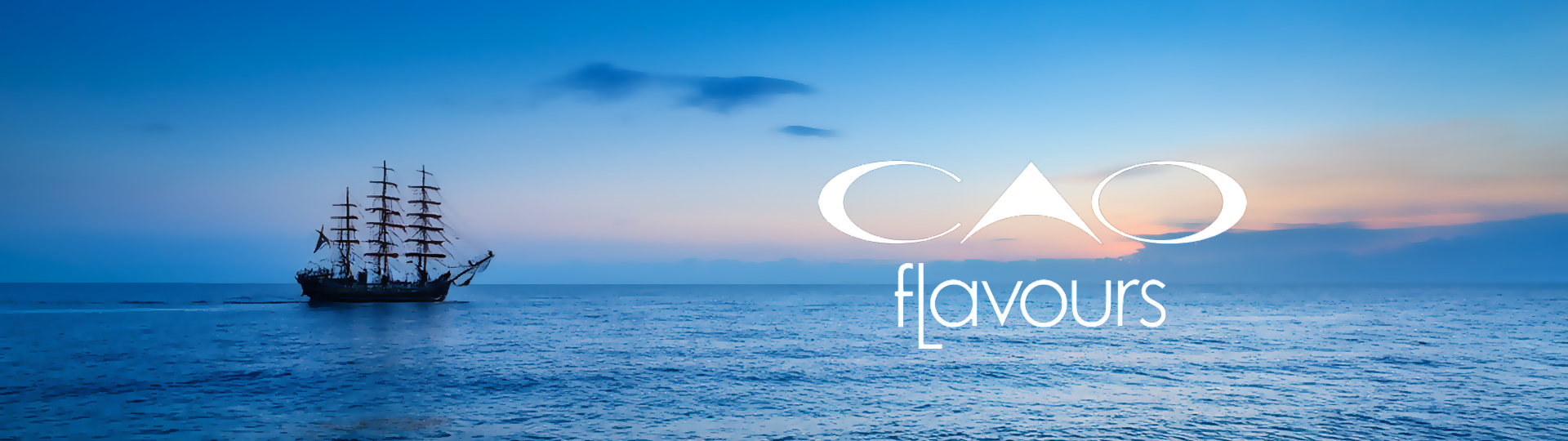 A ship at dusk next to a CAO Flavours logo