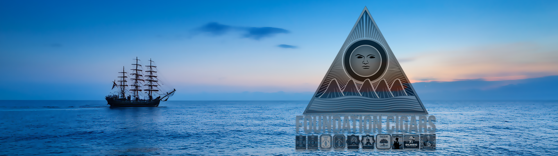 Silhouette of a tall sailing ship on a peaceful ocean at sunset with colorful sky, featuring the Foundation logo overlay.