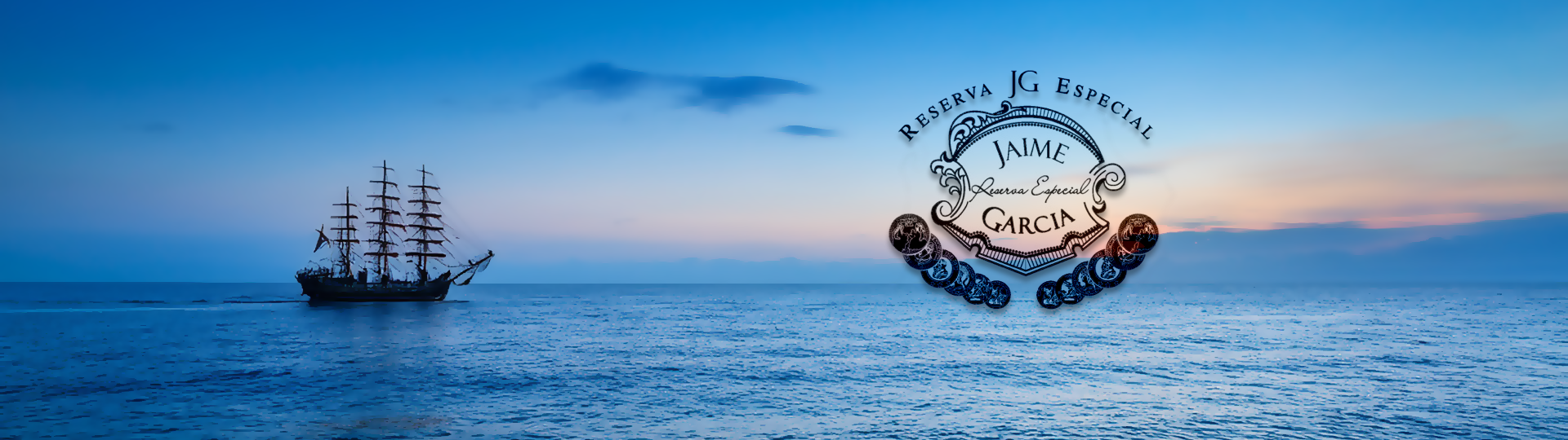 Silhouette of a tall sailing ship on a peaceful ocean at sunset with colorful sky, featuring the Jaime Garcia logo overlay.