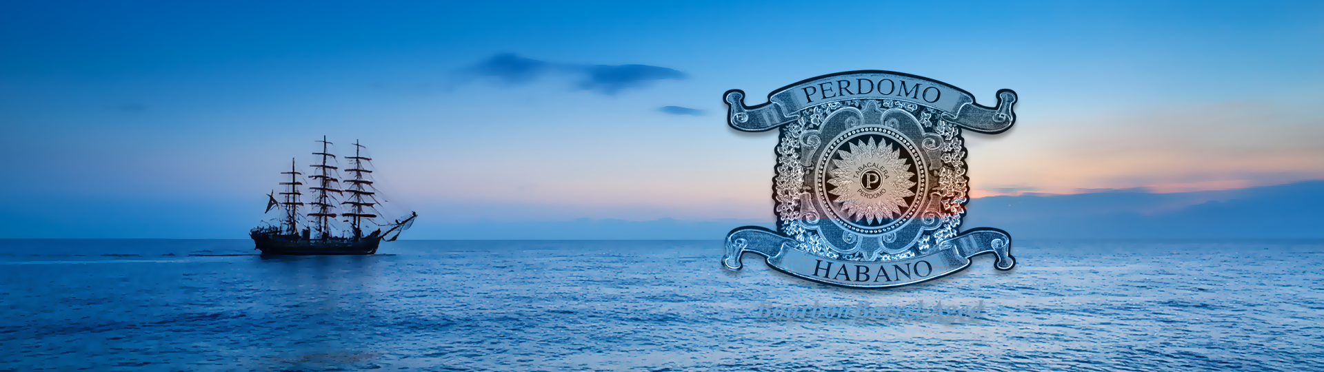 Silhouette of a tall sailing ship on a peaceful ocean at sunset with colorful sky, featuring the Perdomo Habano logo overlay.