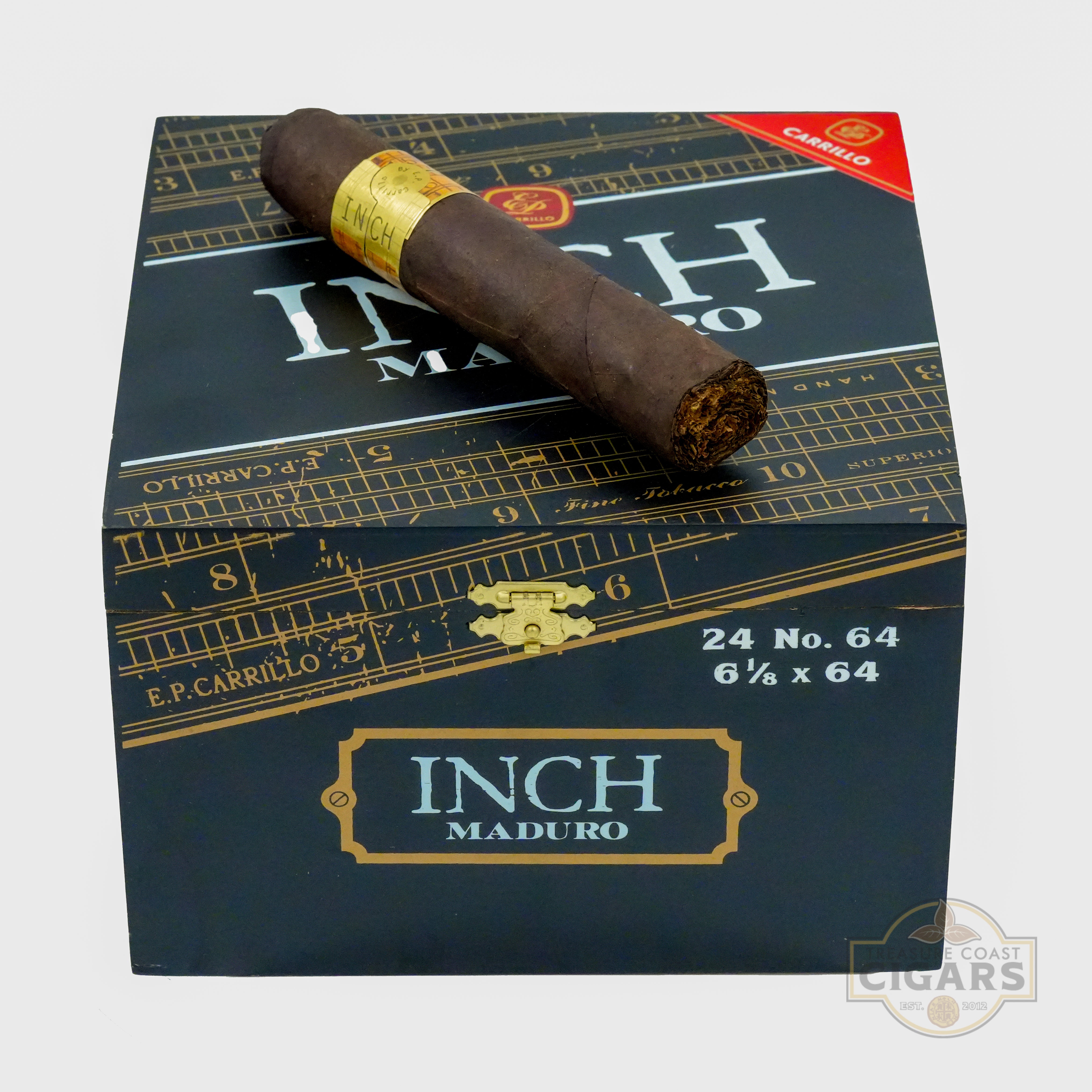 Cigar box with a cigar on top, featuring 'E.P. Carrillo' branding.