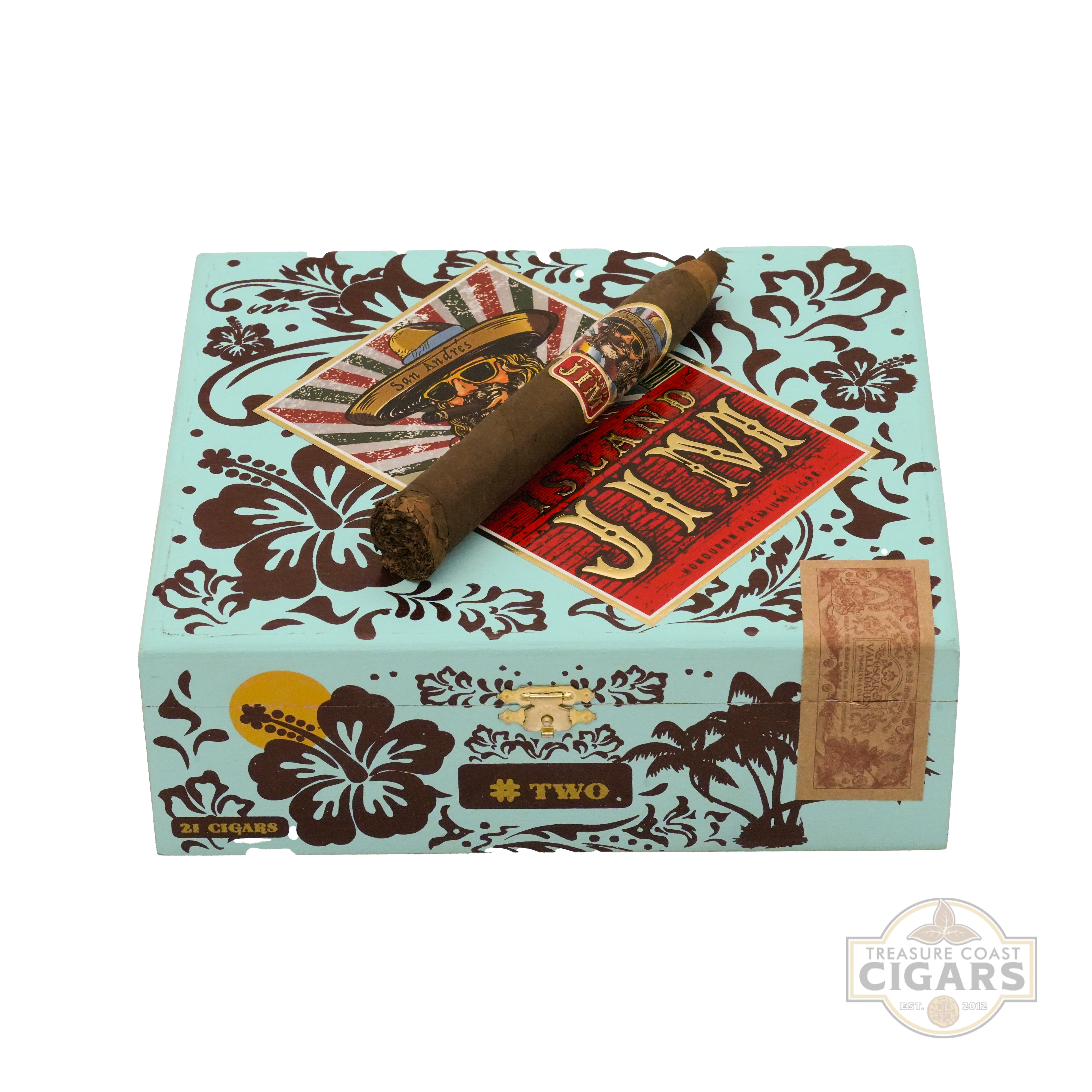 A turquoise cigar box with a decorative design featuring hibiscus flowers, palm trees, and swirling patterns is shown. On the top of the box, there is a single premium cigar with a colorful band displaying the text "Island Jim."