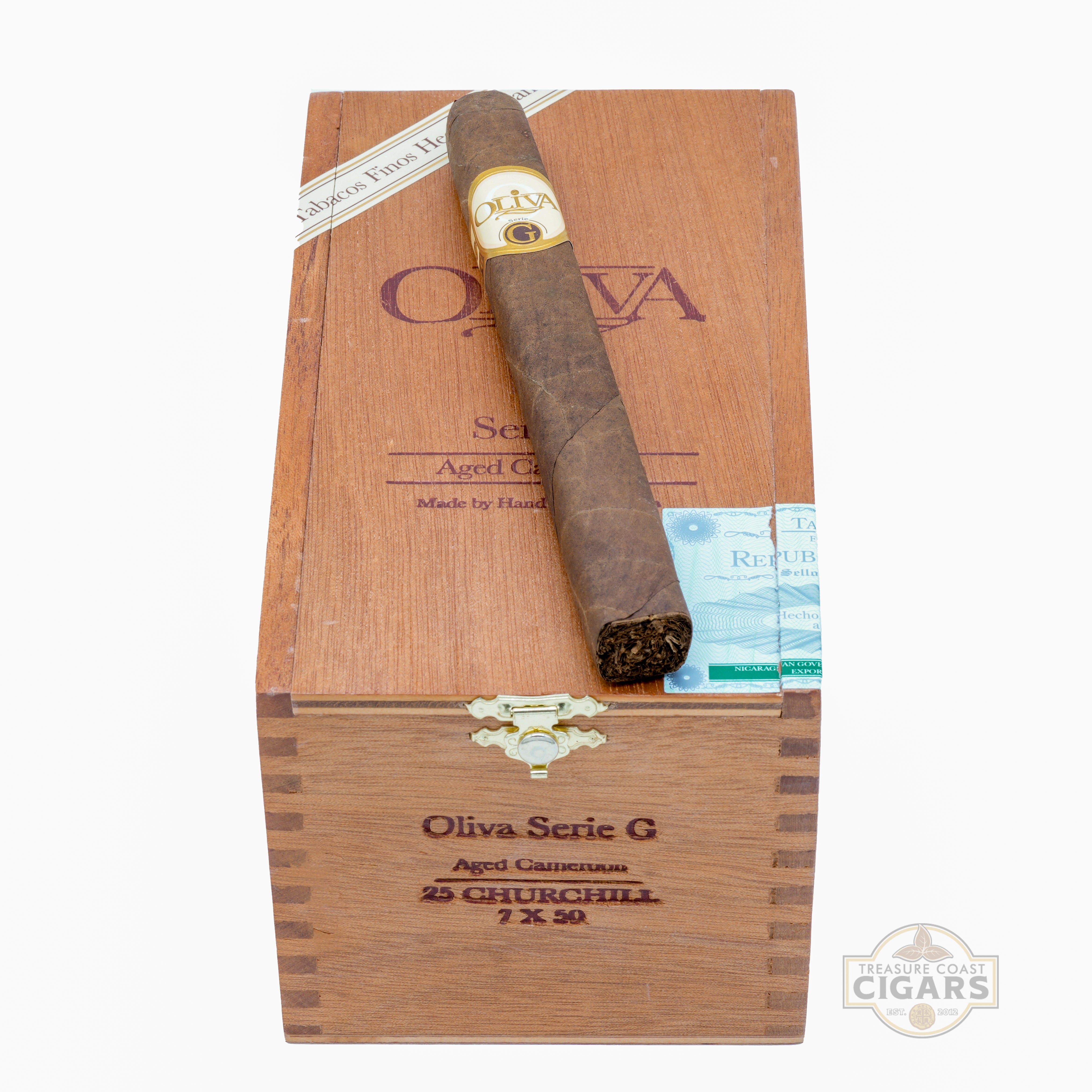 Cigar and packaging with Oliva branding on a white background