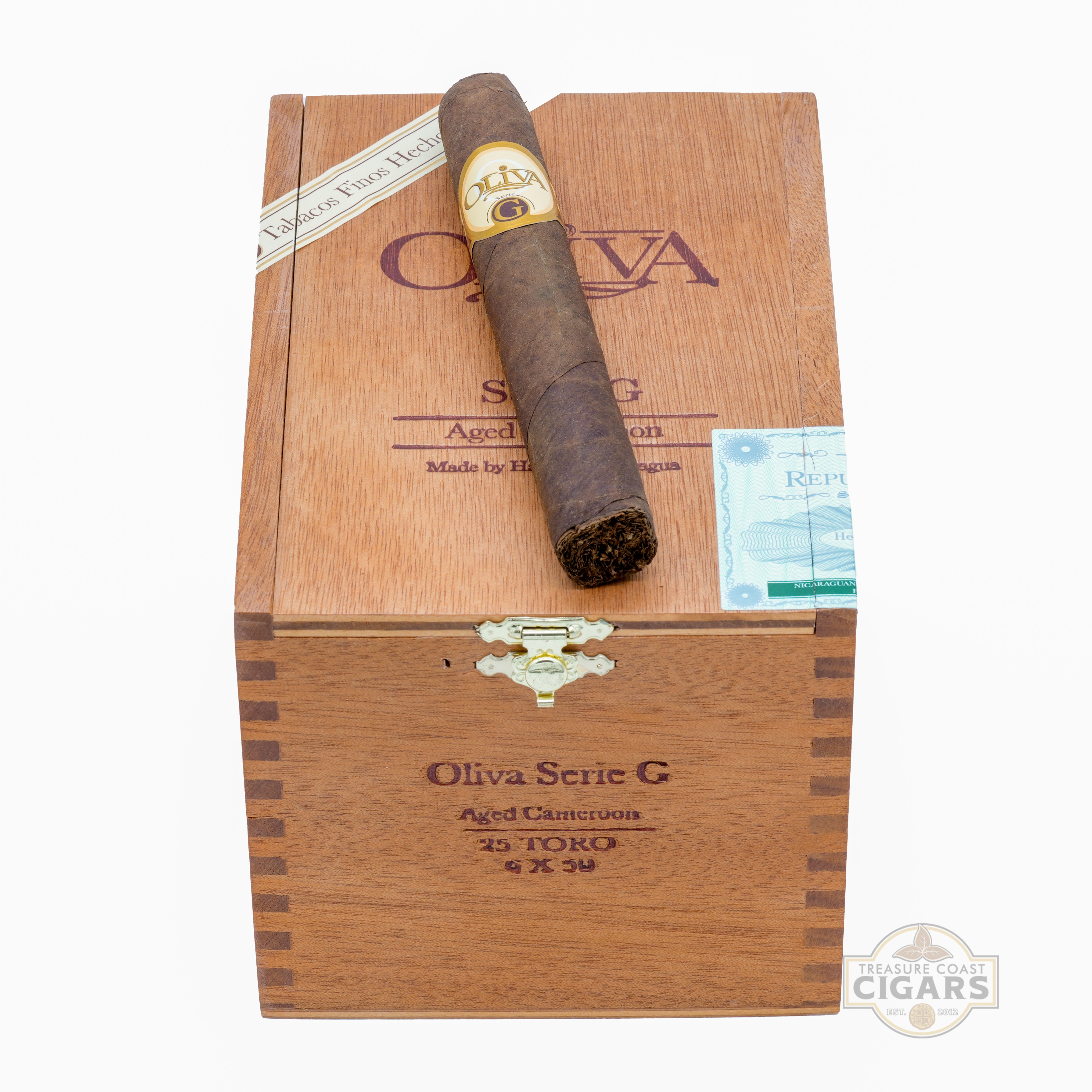 Cigar in a wooden box with Oliva branding on a white background