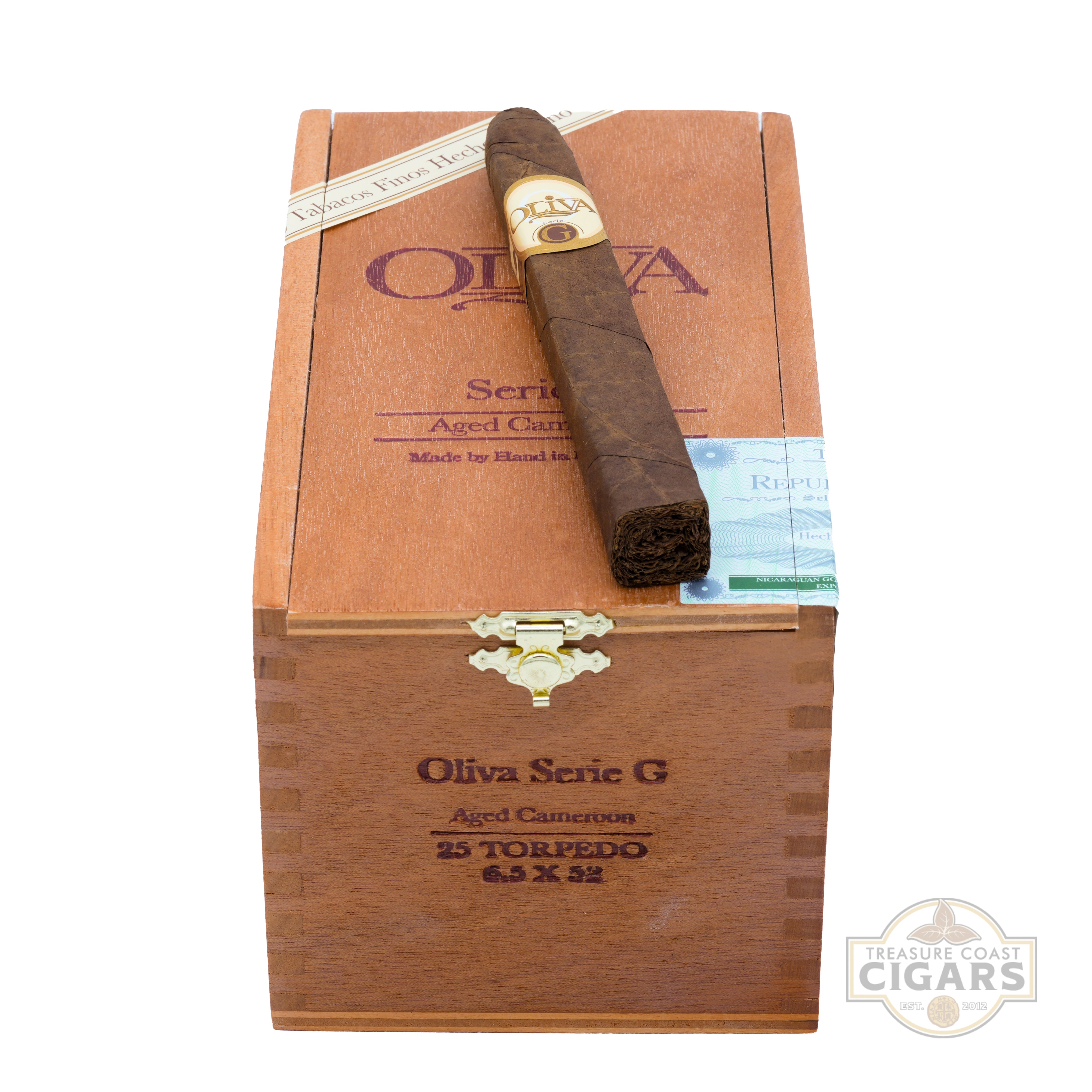 Olivia Series G aged Cameroon cigar in a wooden box with a visible brand logo.