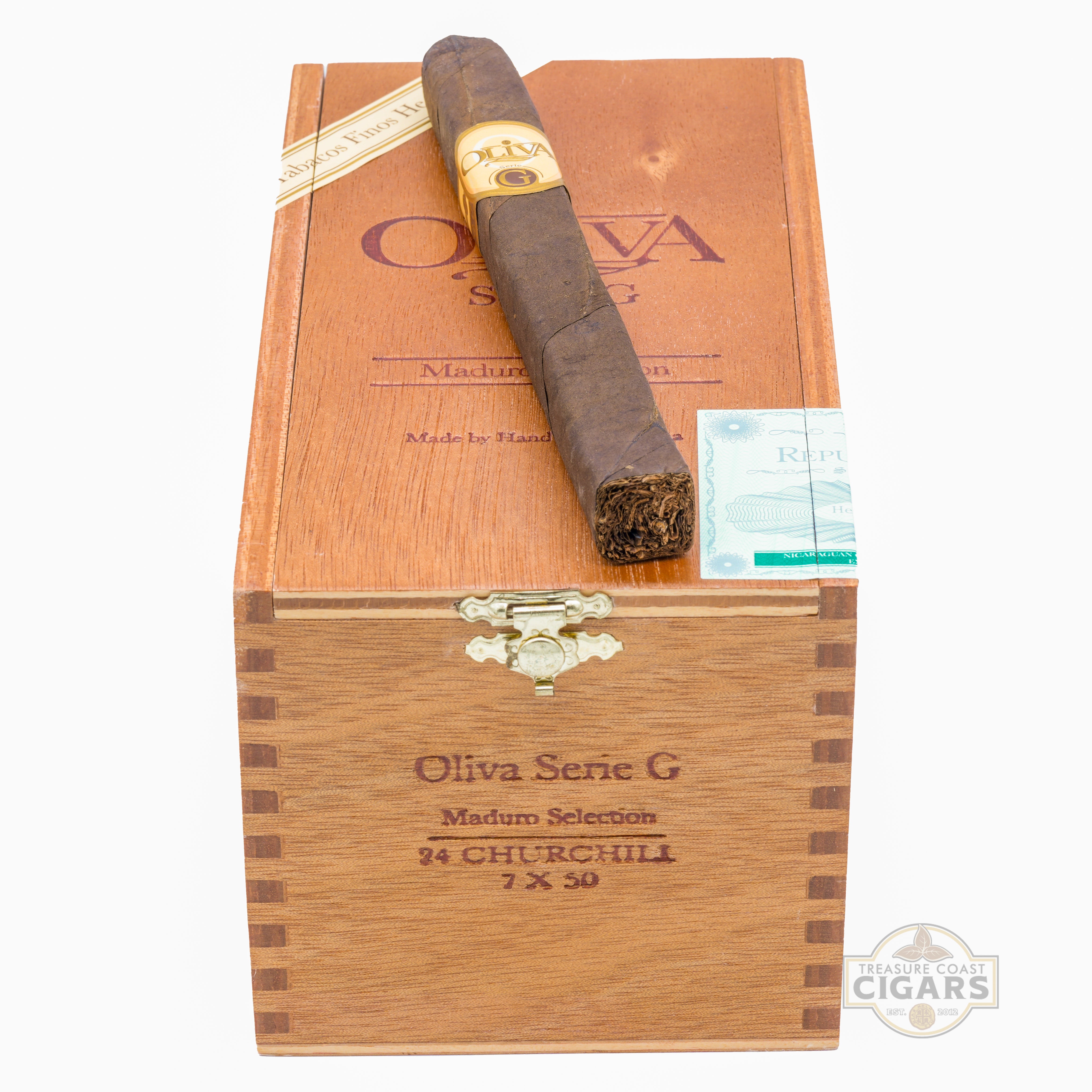 Cigar on top of a wooden box with Oliva Serie G branding