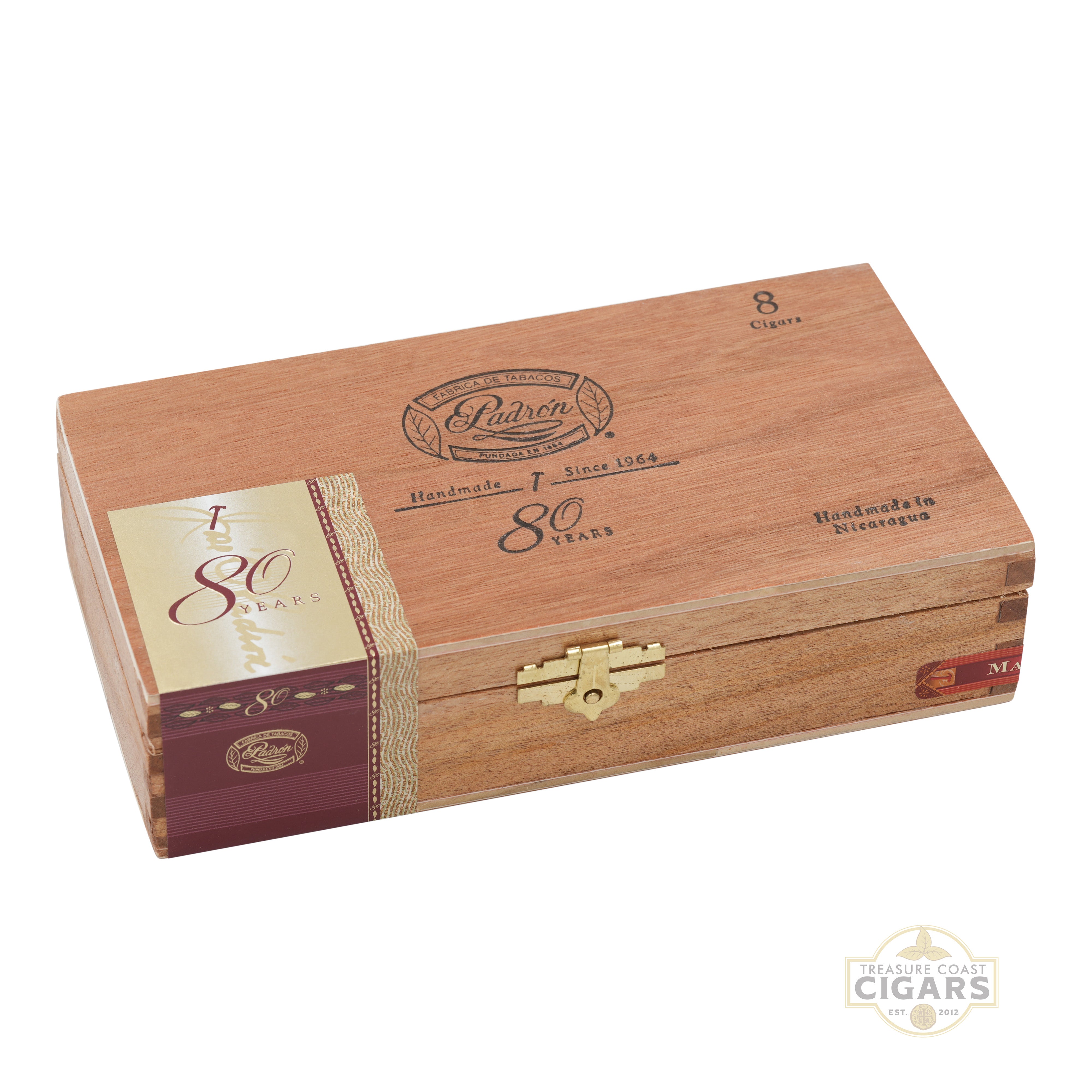 Wooden cigar box with gold accents and '80 Years' branding on a white background