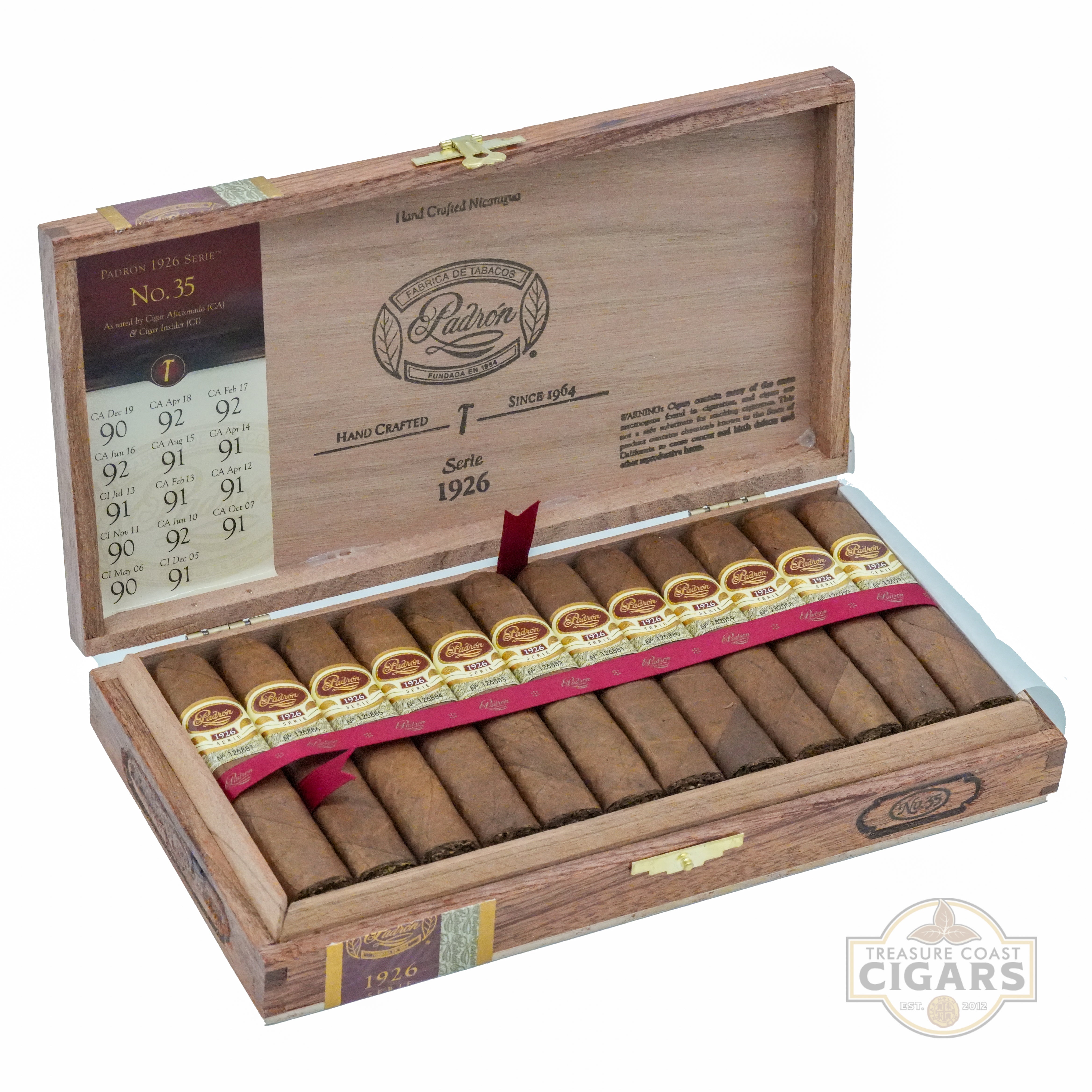 Wooden box of Padron cigars with cigars inside on a white background