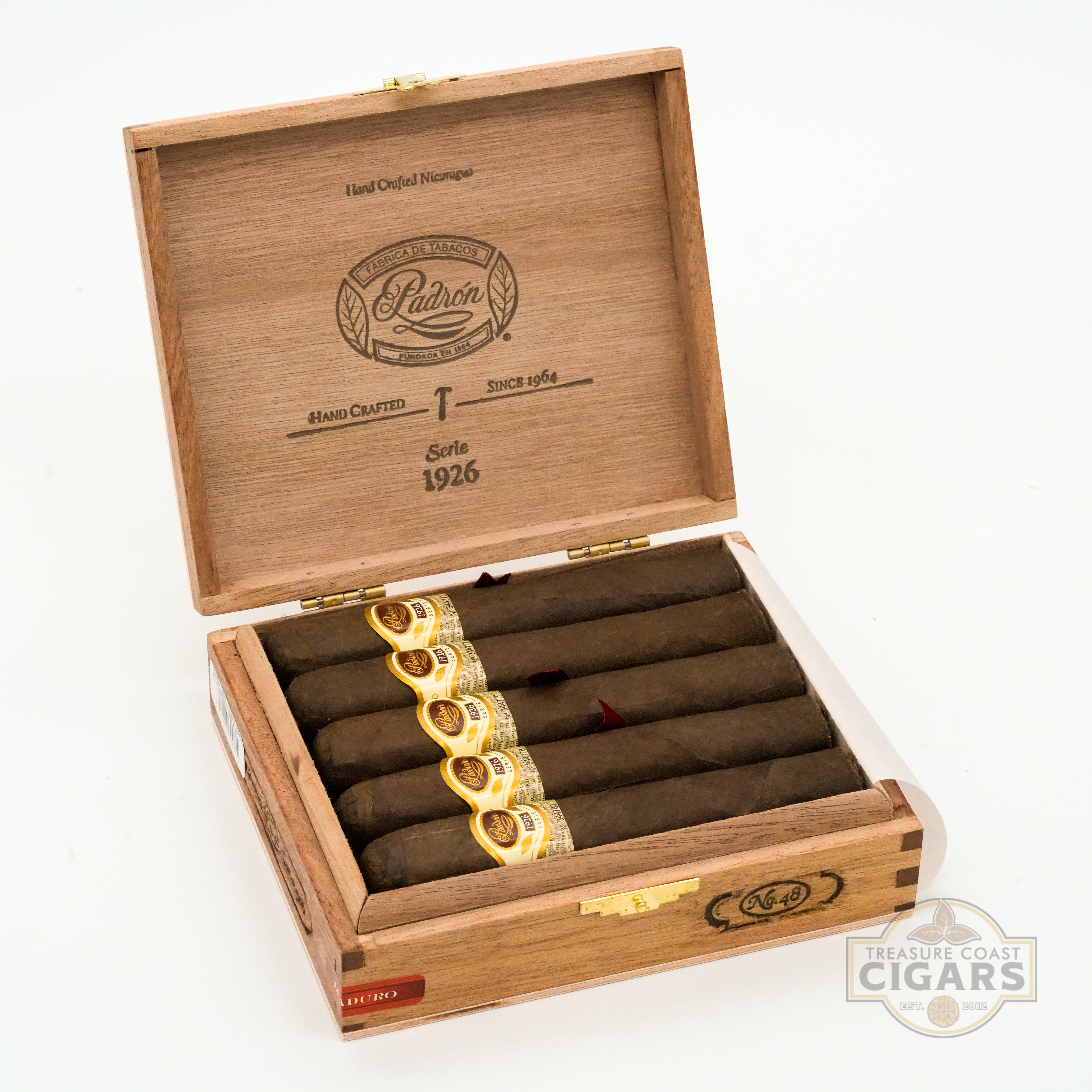 Wooden cigar box with cigars inside, featuring Padron logo on a white background