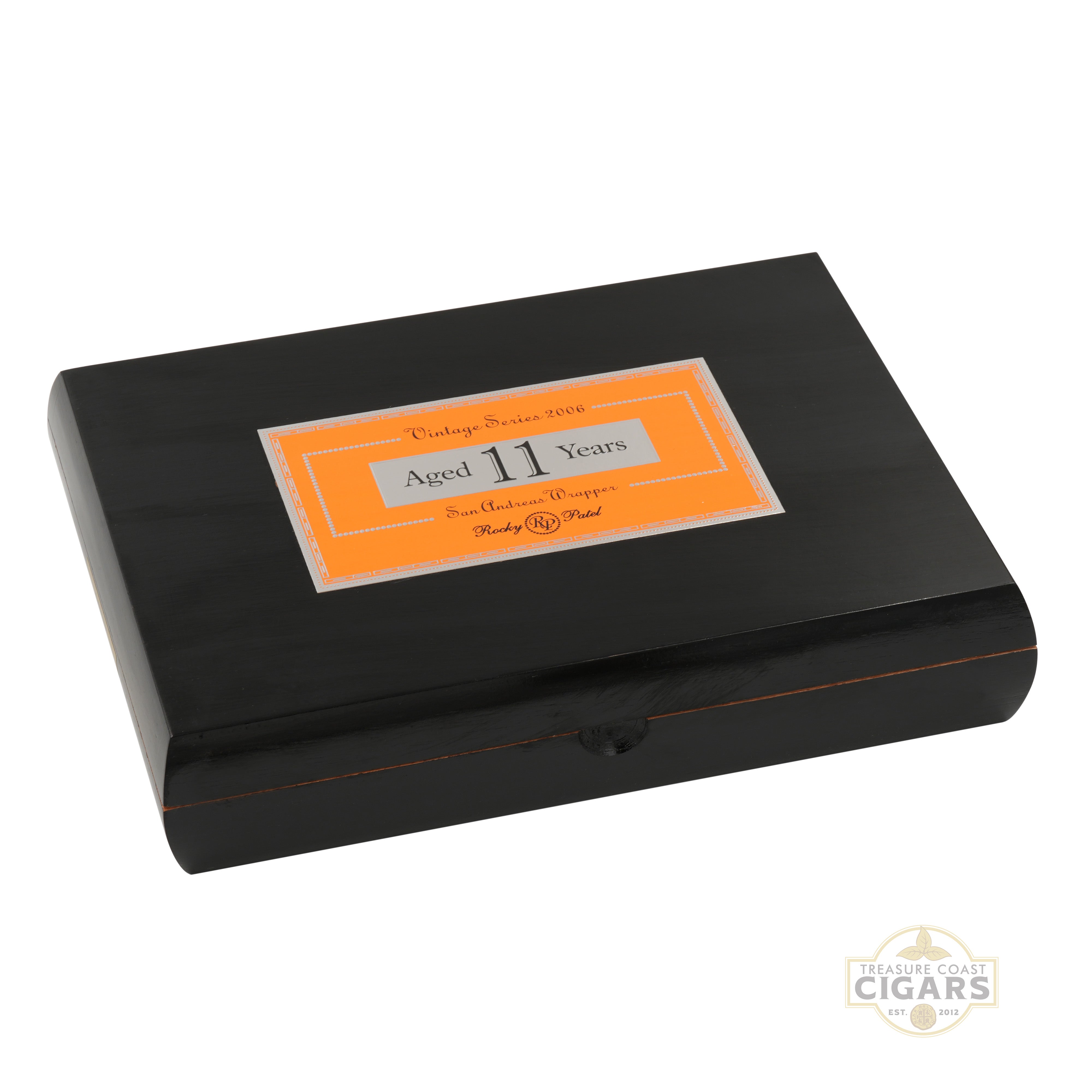 Black Rocky Patel 2006 cigar box with an orange label on a white background