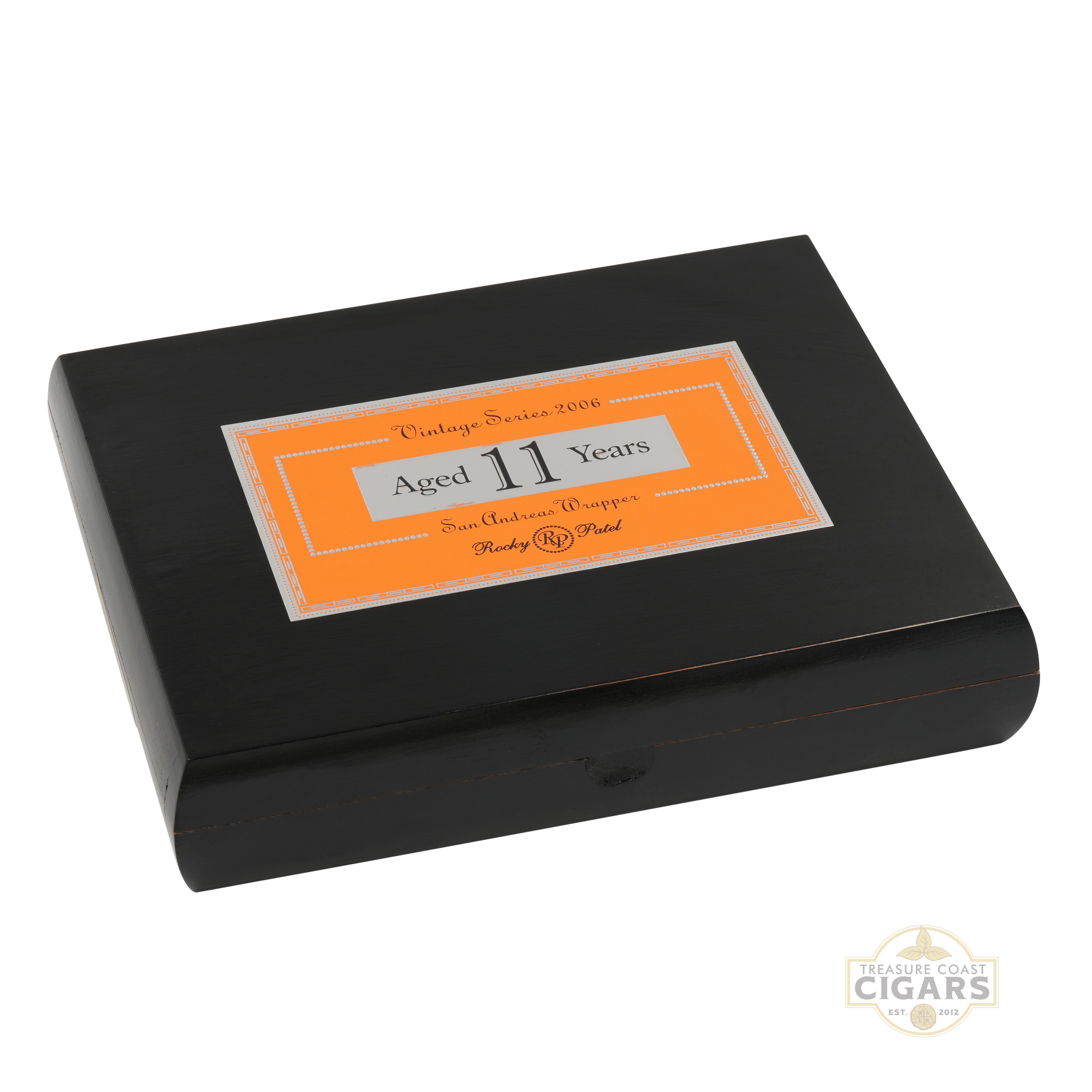 Black Rocky Patel 2006 cigar box with an orange label on a white background