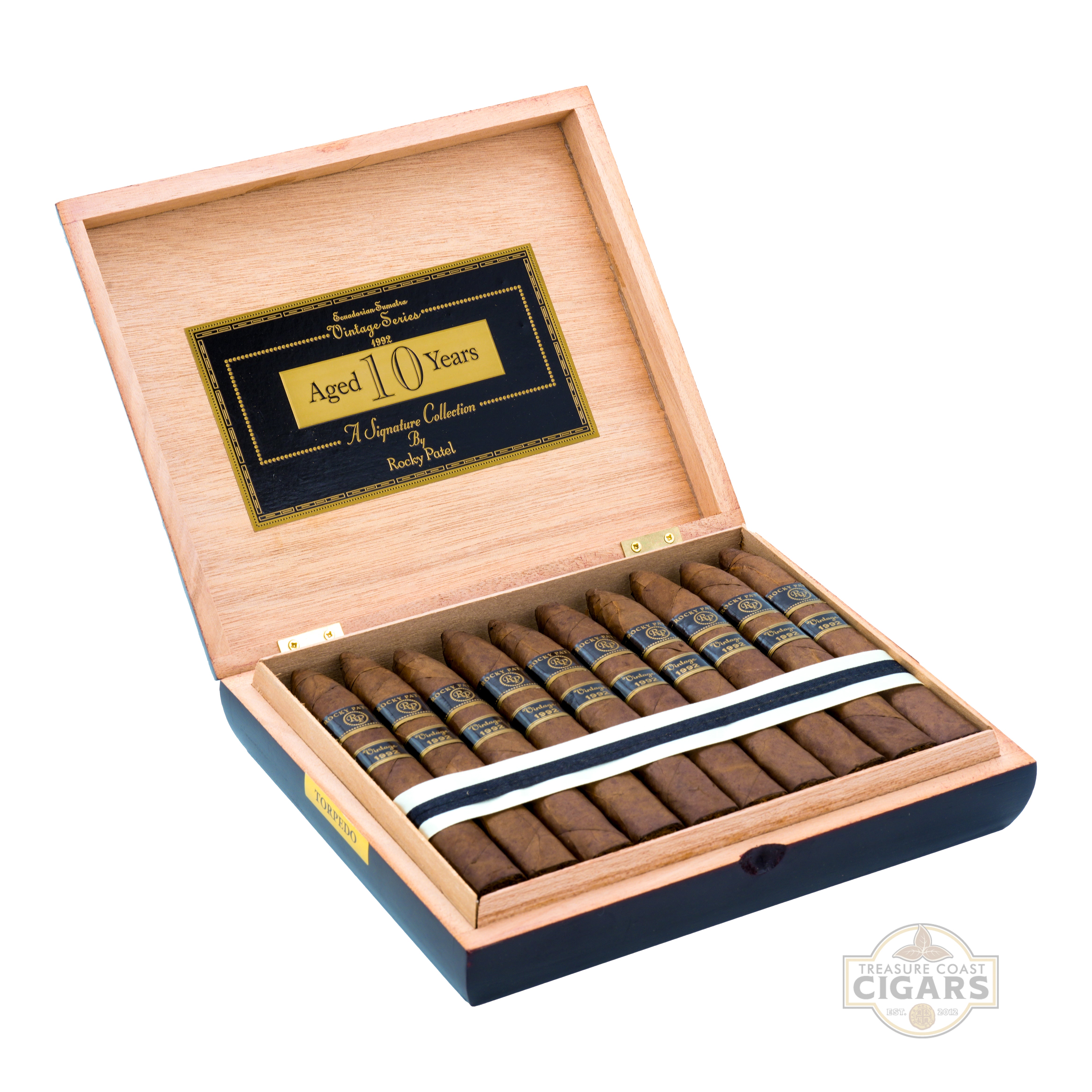 Open wooden cigar box filled with cigars on a white background