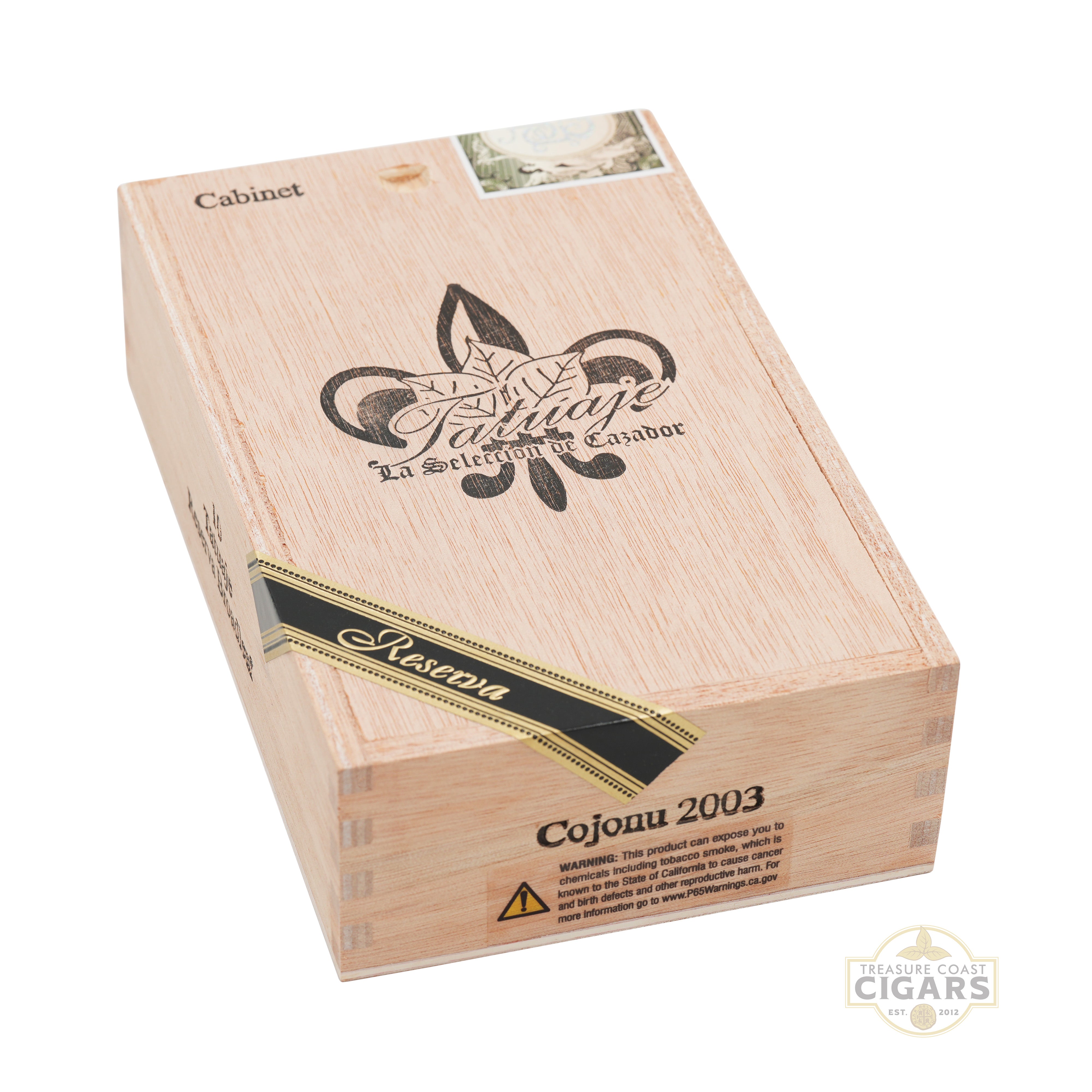 Wooden cigar box with 'Tatuaje' branding on a white background