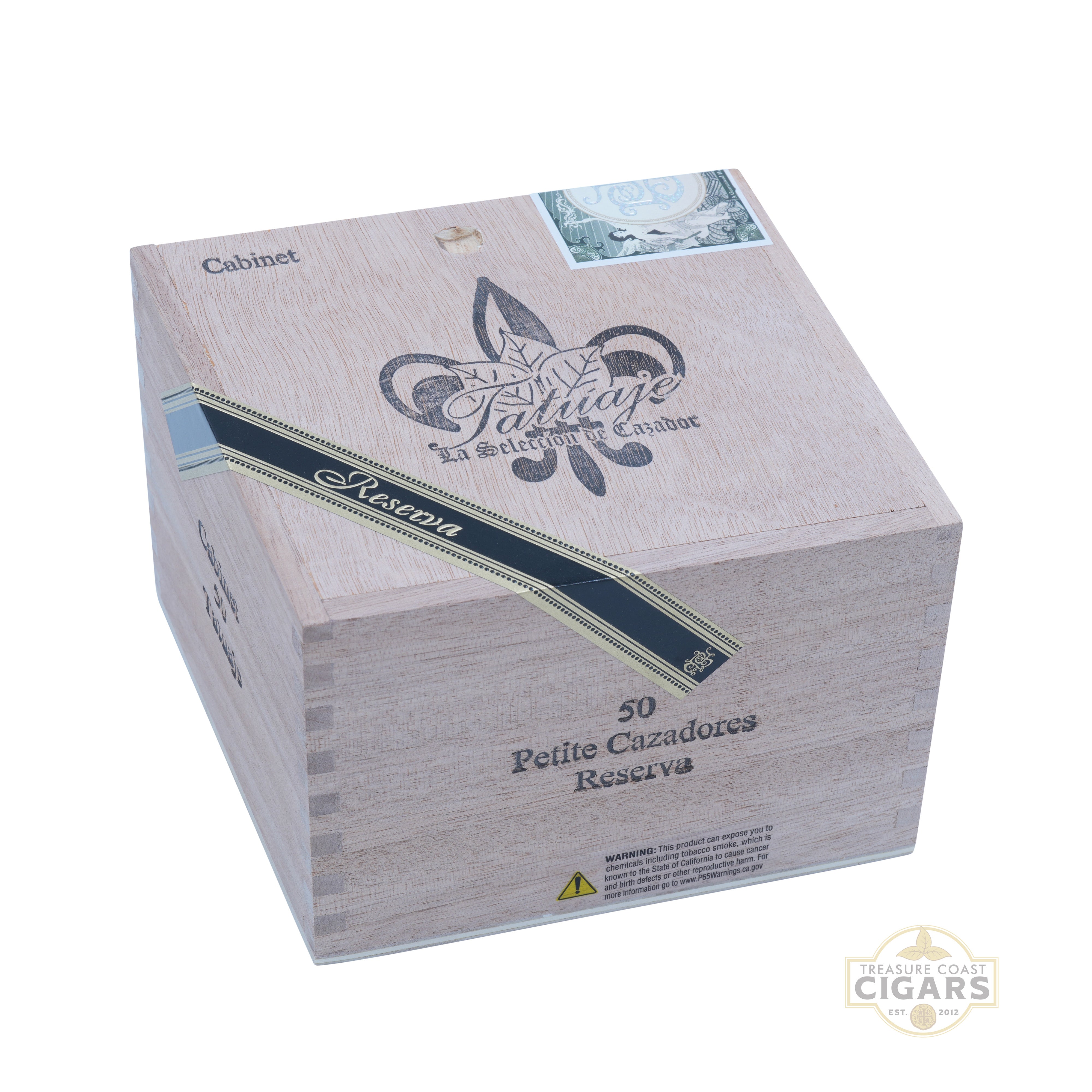 Cigar box with 'Petite Cazadores Reserva' branding on a white background