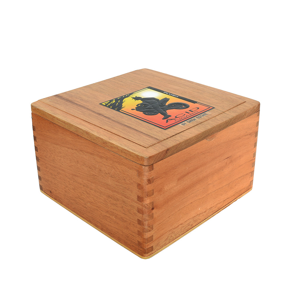 Closed wooden box with a decorative ACID cigar label on a white background