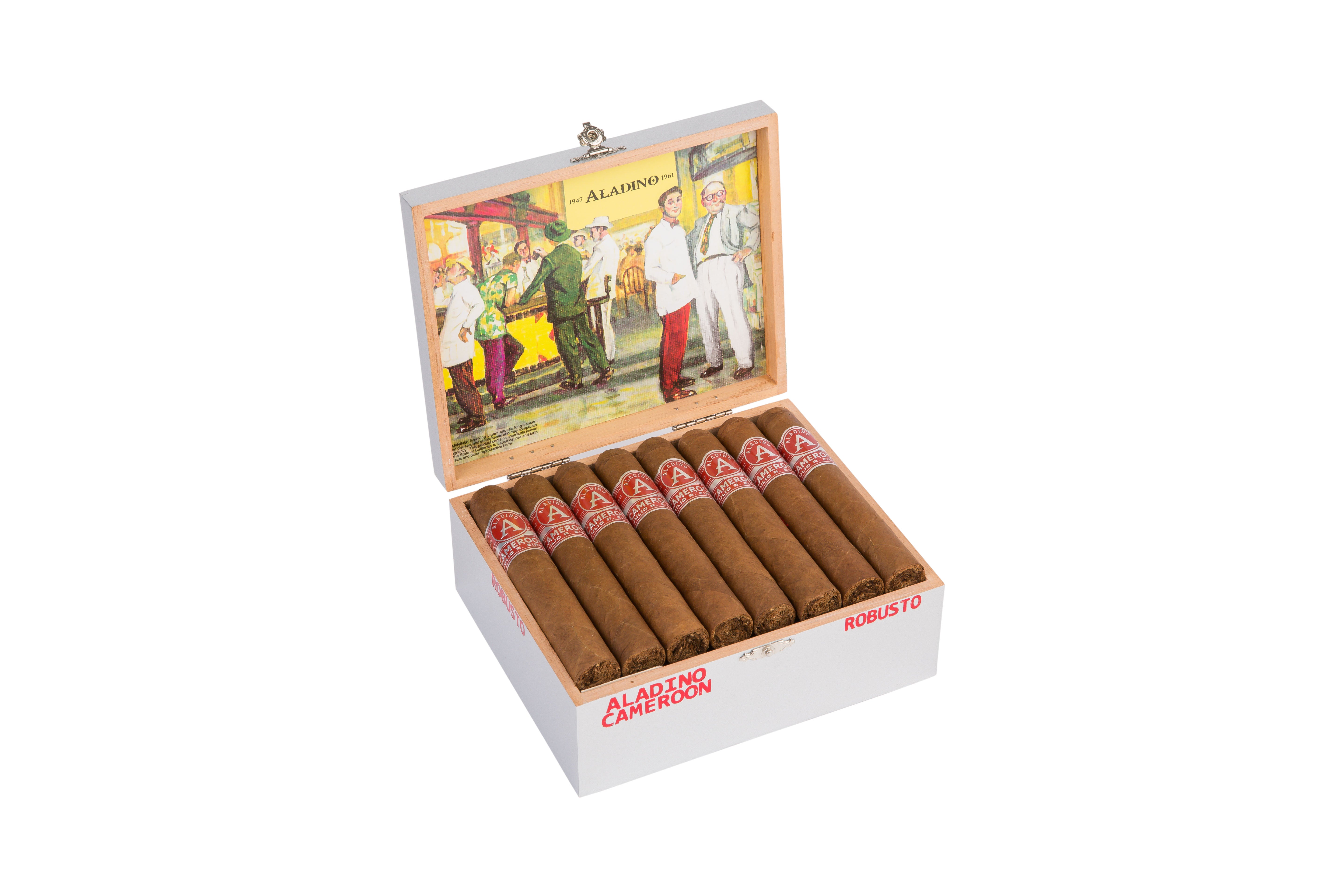 Open box of Aladino Cameroon Robusto cigars. The box contains neatly arranged cigars with red and silver labels featuring the Aladino logo. The interior lid of the box displays a colorful illustration of people in vintage clothing, including a man in a white suit and red pants, standing in a tropical setting with greenery and a yellow background. The exterior of the box is silver with red text indicating Aladino Cameroon robusto