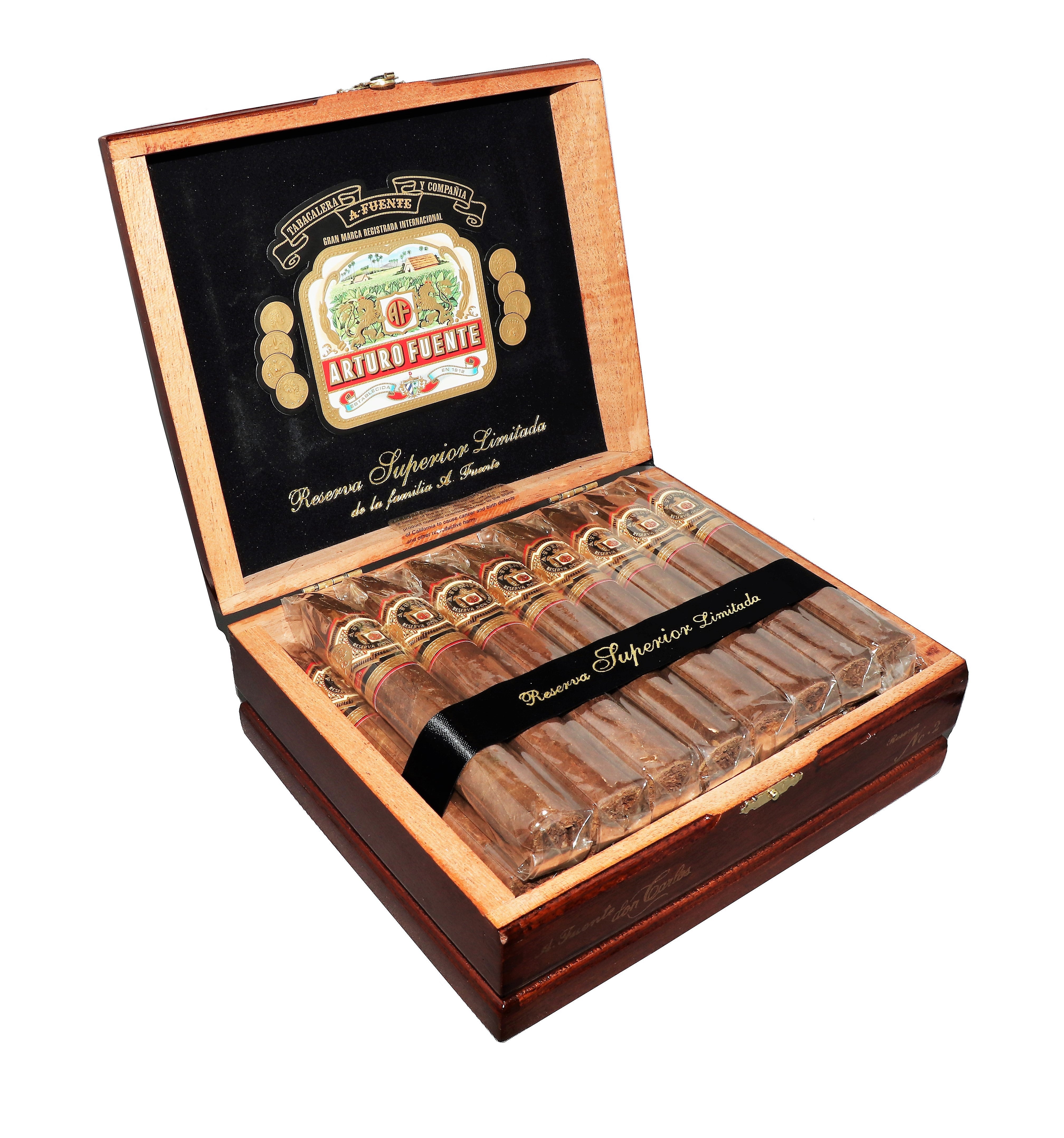 Open wooden box of Arturo Fuente cigars with cigars inside on a white background