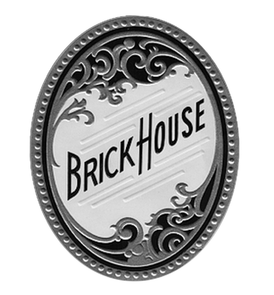 Decorative round emblem with 'Brick House' text on a white background
