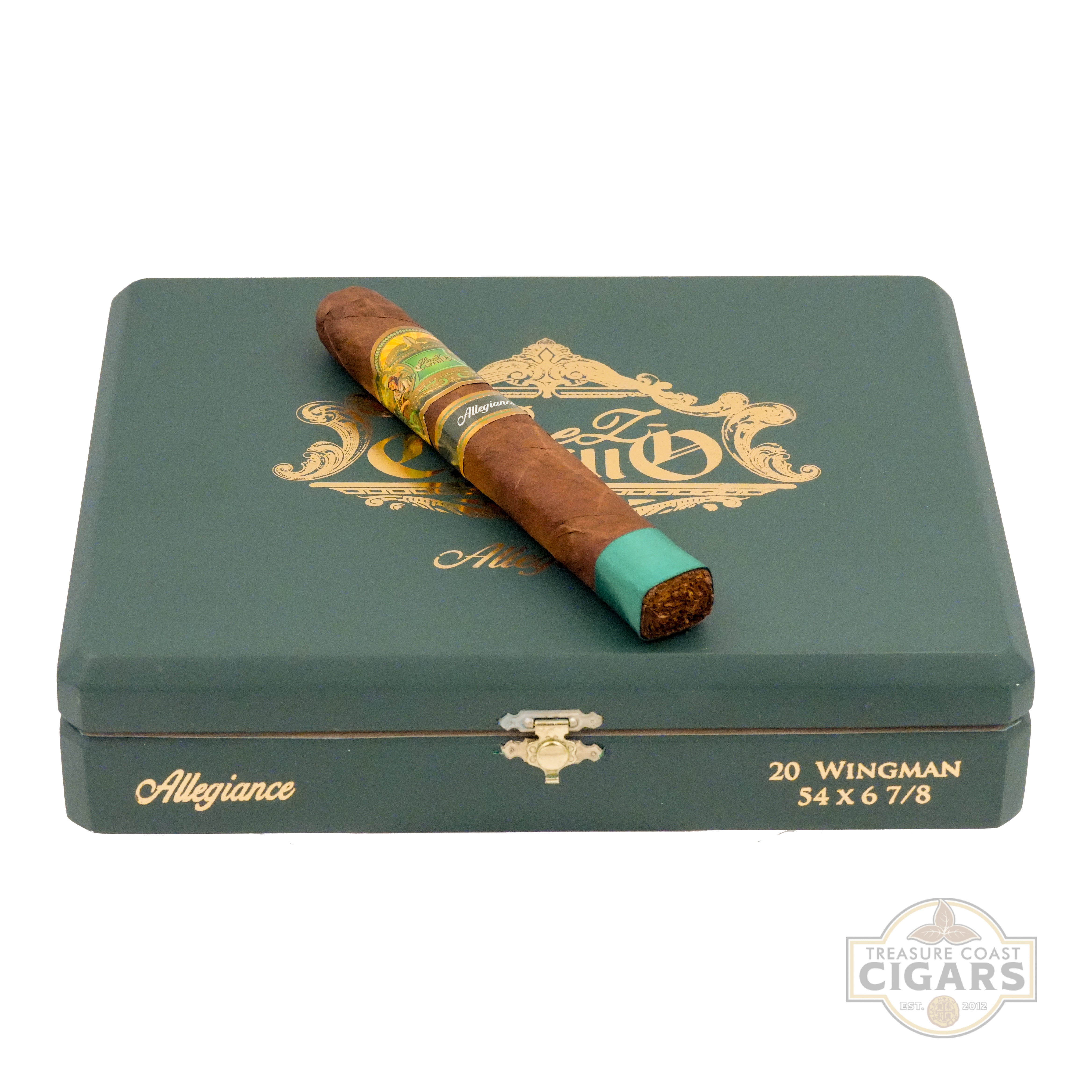 Cigar on a green metal box with gold accents and 'Treasure Coast Cigars' branding.