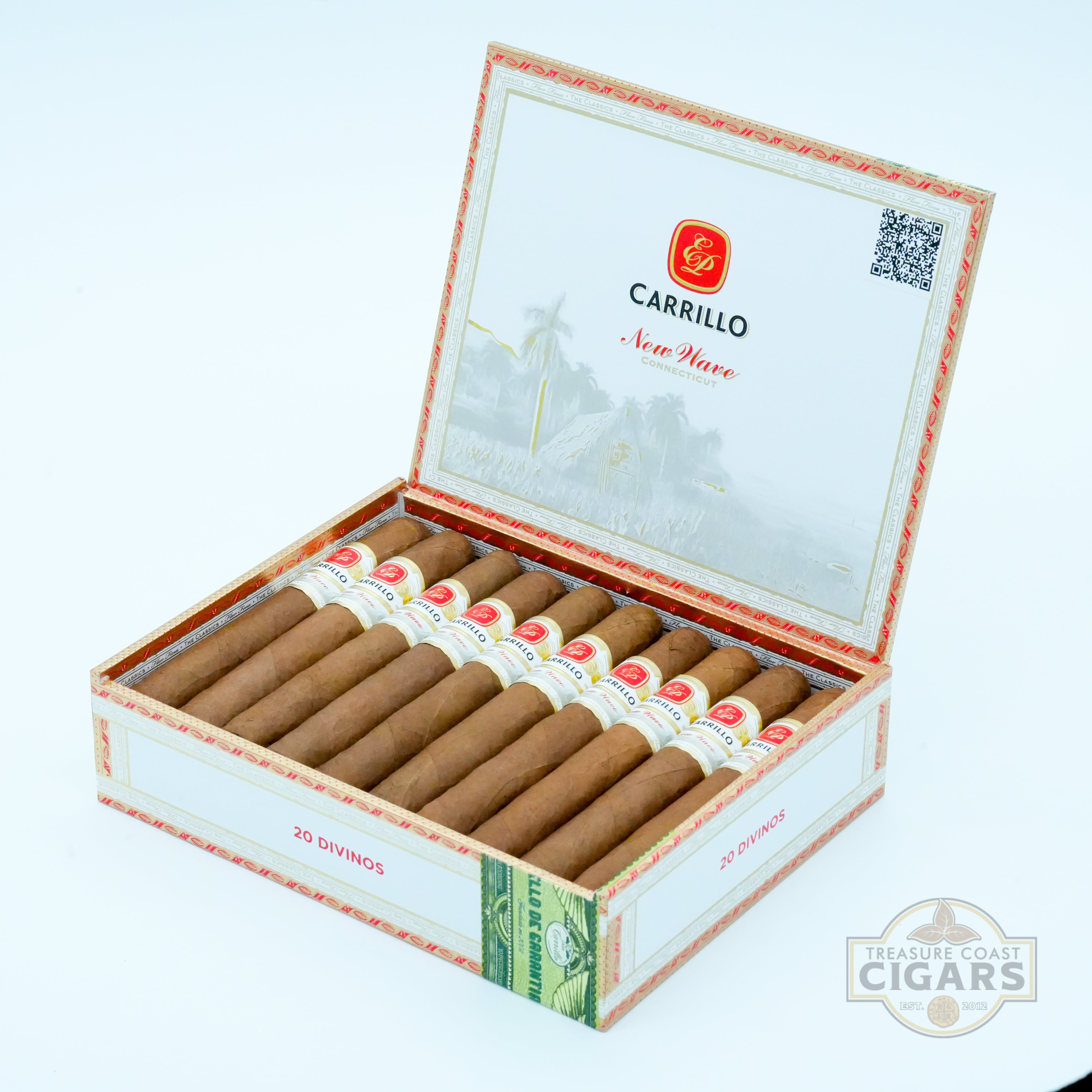 Open box of Carrillo cigars with visible branding on a light blue background