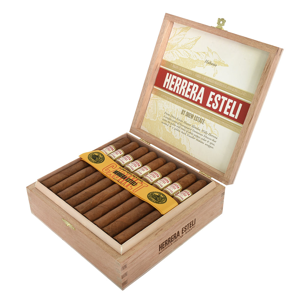 Open wooden box of Herrera Esteli cigars on a white background