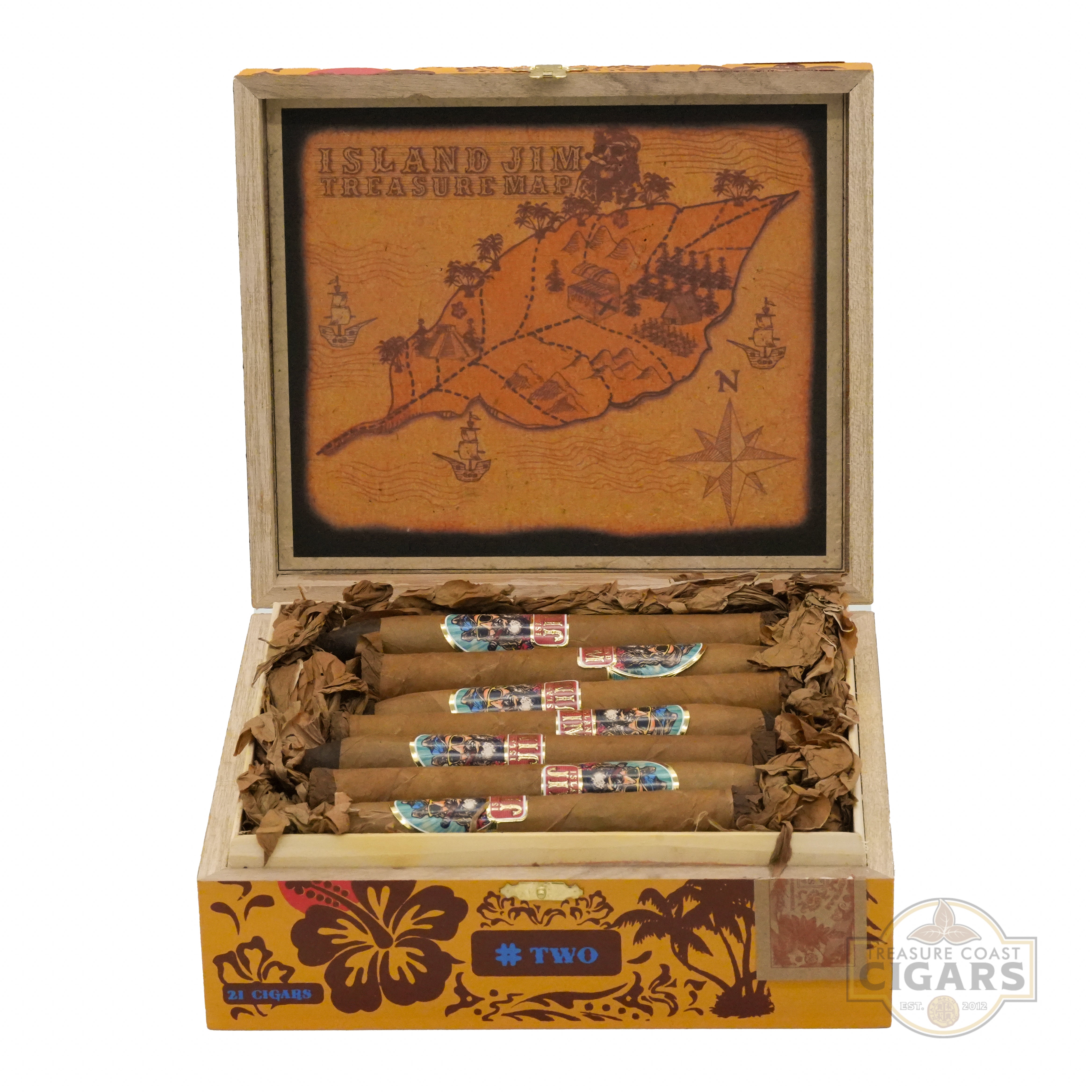 An open wooden cigar box labeled "Island Jim Treasure Map" on the lid, featuring an intricate design of treasure map with a leaf shape, compass, ships, and palm trees in shades of orange and brown. Inside, the box contains 21 cigars wrapped in light brown tobacco leaves, each adorned with colorful bands displaying the "Island Jim" logo and decorative elements. The interior is lined with dried tobacco leaves, and the box's sides are decorated with tropical floral patterns and the text "#Two" and "21 CIGARS.