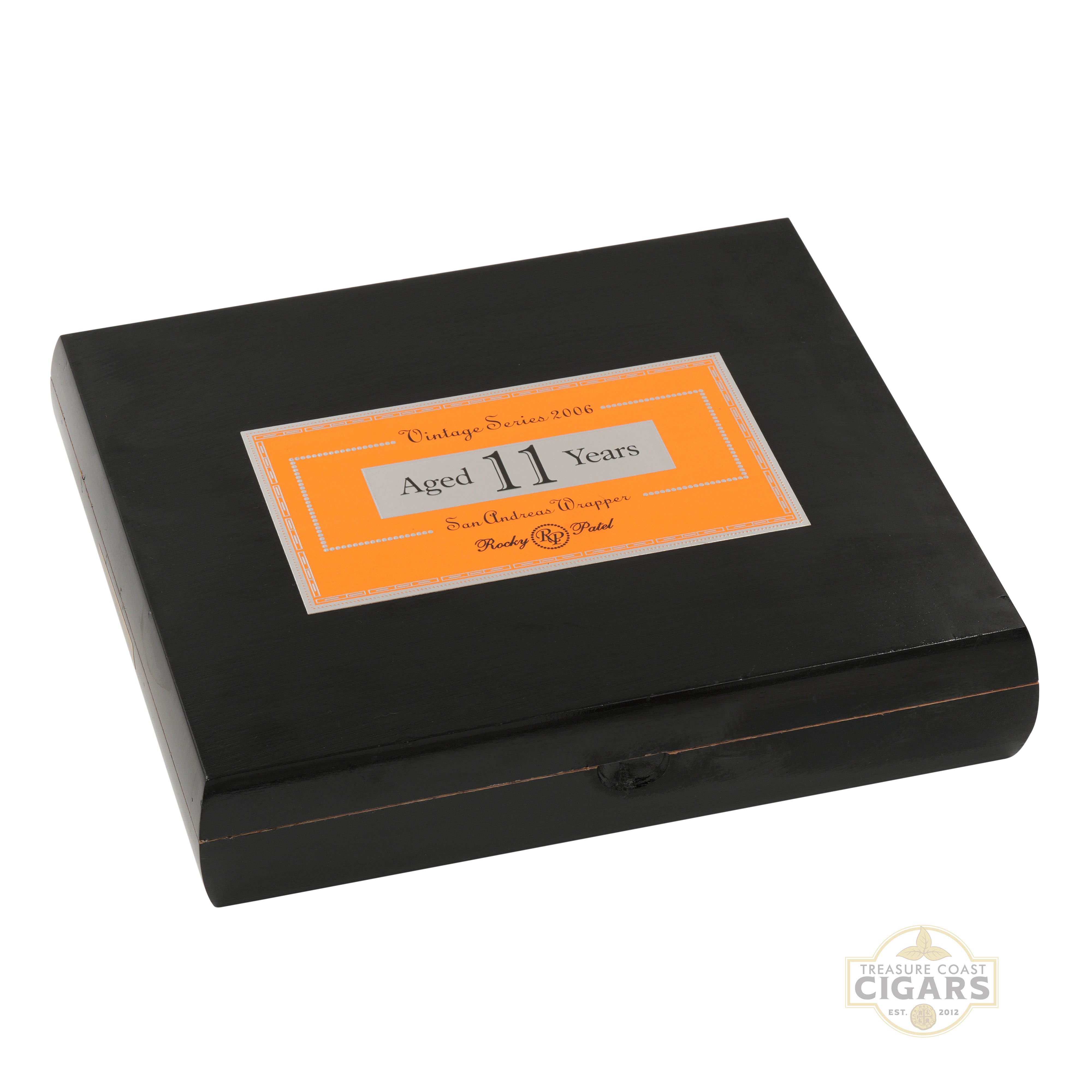 Black Rocky Patel 2006 cigar box with an orange label on a white background