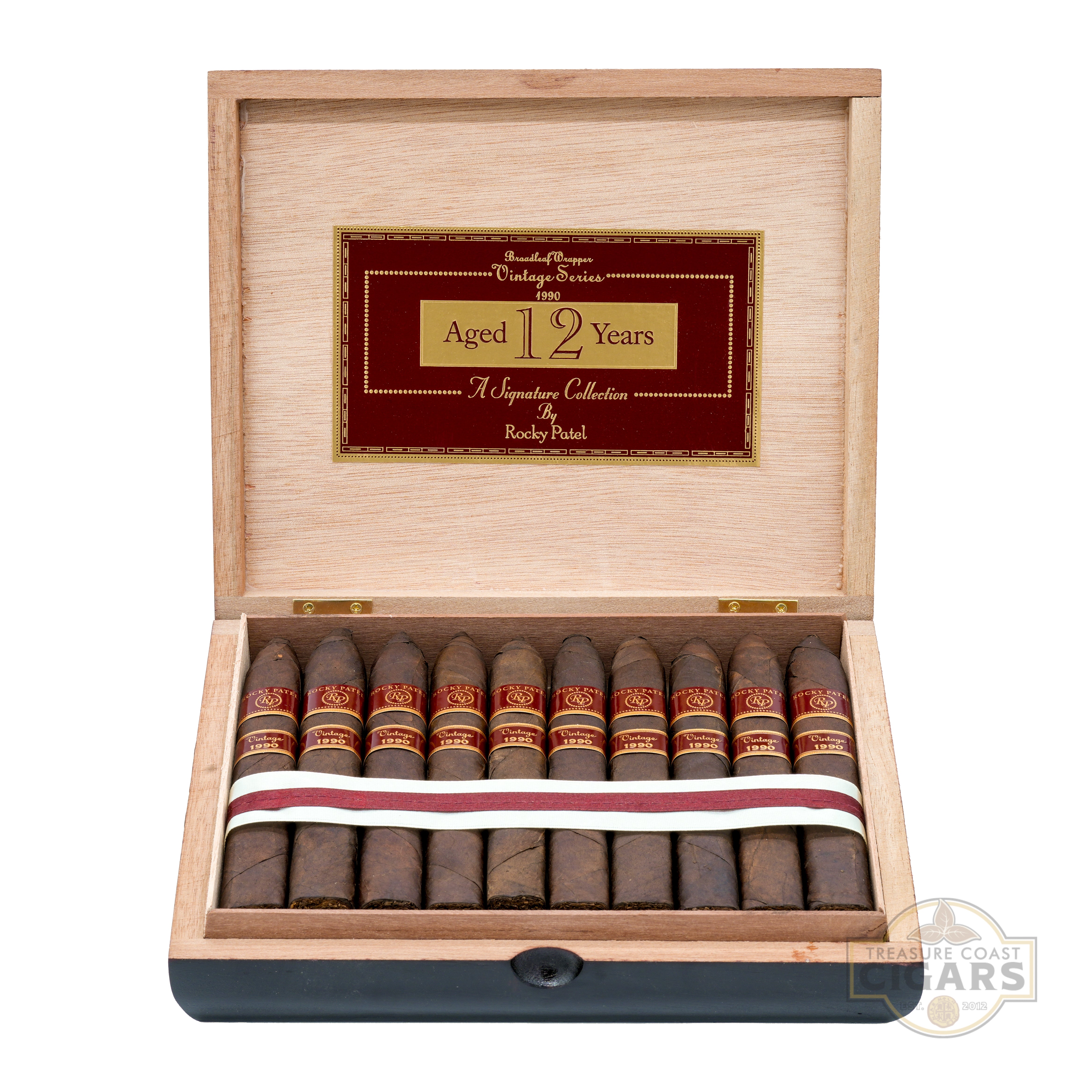 Open wooden humidor with cigars and a visible brand logo on a white background