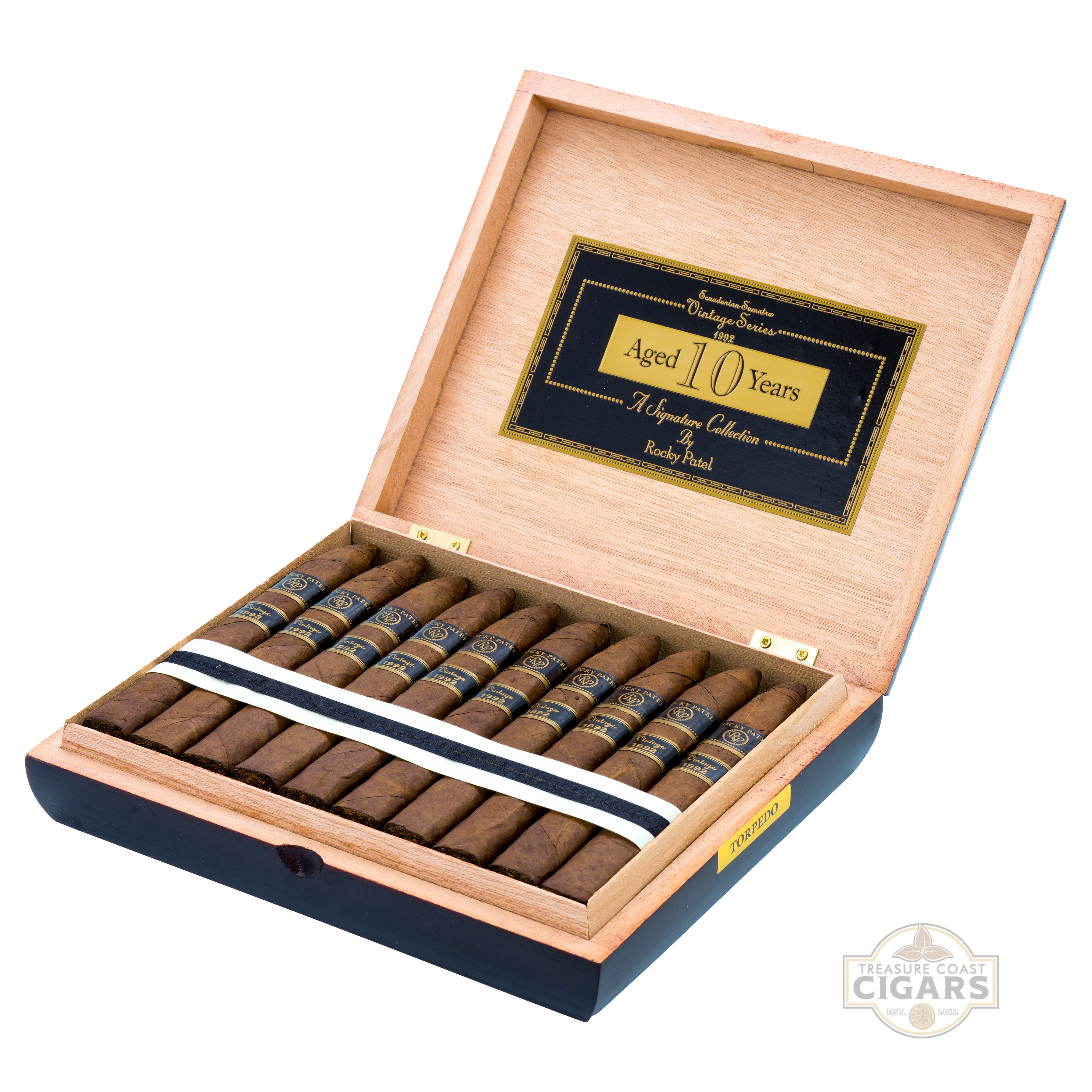 Open cigar box with cigars and a label indicating 'Aged 10 Years' on a white background.