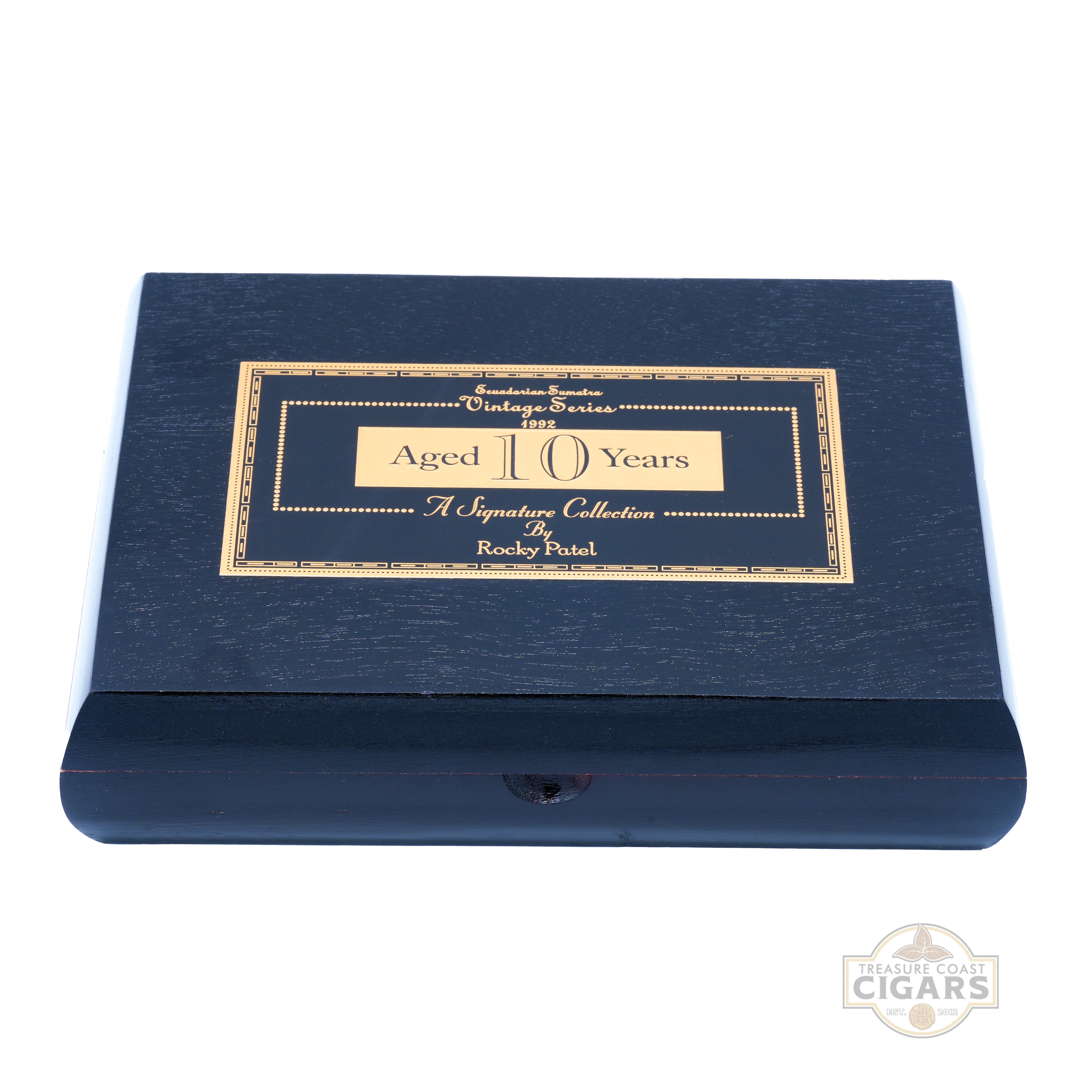 Black cigar box with gold text on a white background